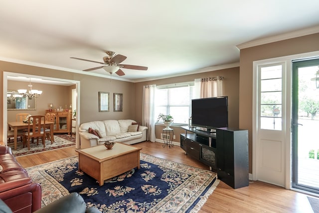 220 Pitts Chapel Rd, Newborn, GA 30056 - living area featuring wood finished floors, crown molding, and ceiling fan with notable chandelier