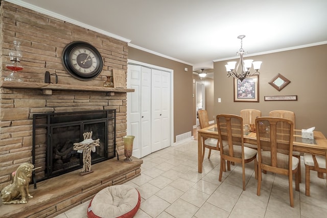 220 Pitts Chapel Rd, Newborn, GA 30056 - tiled dining room featuring a stone fireplace, visible vents, ornamental molding, and a notable chandelier
