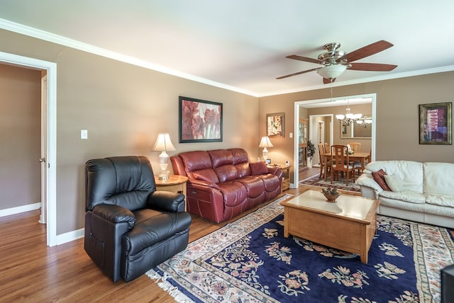 220 Pitts Chapel Rd, Newborn, GA 30056 - living area with baseboards, crown molding, wood finished floors, and ceiling fan with notable chandelier