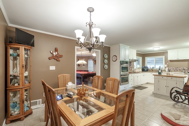 220 Pitts Chapel Rd, Newborn, GA 30056 - dining room featuring ornamental molding, visible vents, a notable chandelier, and light tile patterned floors