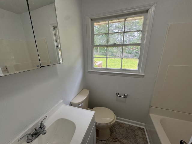 2275 Leo Ct, Milledgeville, GA 31061 - full bathroom featuring healthy amount of natural light, toilet, a tub, and vanity
