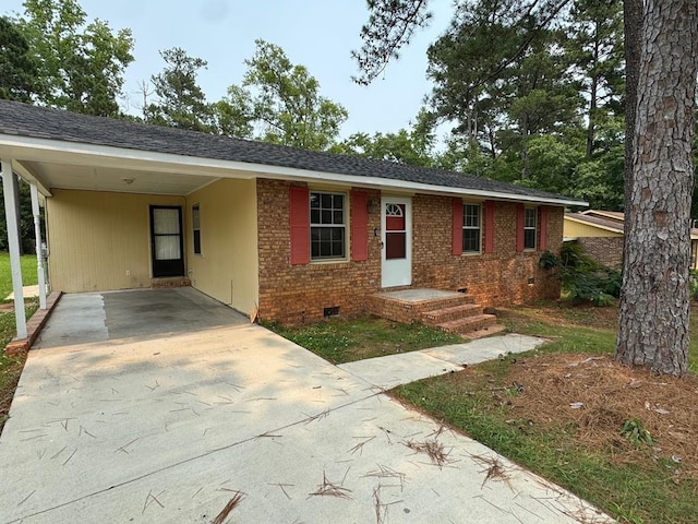 2275 Leo Ct, Milledgeville, GA 31061 - ranch-style house with driveway, crawl space, a carport, and brick siding