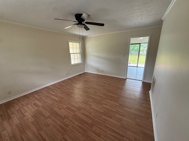 2275 Leo Ct, Milledgeville, GA 31061 - spare room featuring plenty of natural light, dark wood finished floors, a textured ceiling, ceiling fan, and crown molding