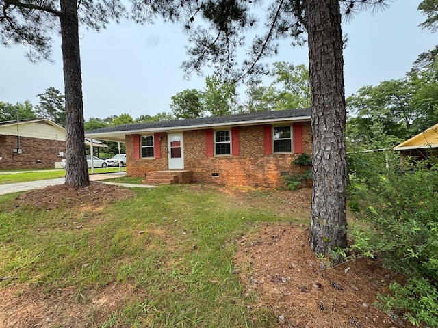 2275 Leo Ct, Milledgeville, GA 31061 - ranch-style house featuring crawl space, driveway, an attached carport, brick siding, and a front lawn