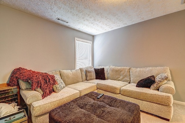 living room with carpet flooring and visible vents