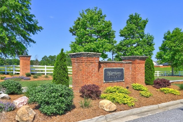 community sign with fence