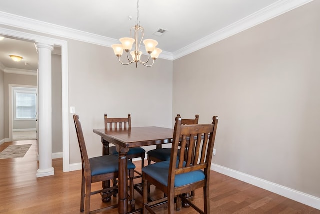 222 Sheffield Dr Unit E-5, Sparta, GA 31087 - dining room with wood finished floors, baseboards, ornamental molding, and visible vents