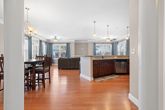 222 Sheffield Dr Unit E-5, Sparta, GA 31087 - kitchen with light wood-style flooring, ceiling fan with notable chandelier, and dishwasher