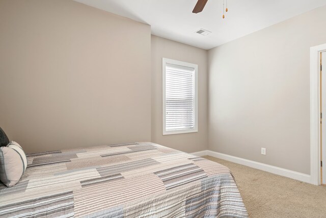 222 Sheffield Dr Unit E-5, Sparta, GA 31087 - carpeted bedroom with ceiling fan, baseboards, and visible vents