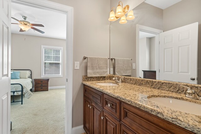 222 Sheffield Dr Unit E-5, Sparta, GA 31087 - bathroom with double vanity, baseboards, a sink, and ceiling fan with notable chandelier