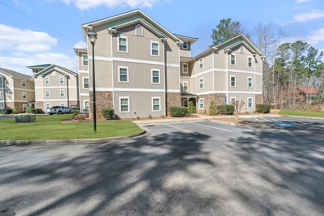 222 Sheffield Dr Unit E-5, Sparta, GA 31087 - view of building exterior with a residential view and uncovered parking