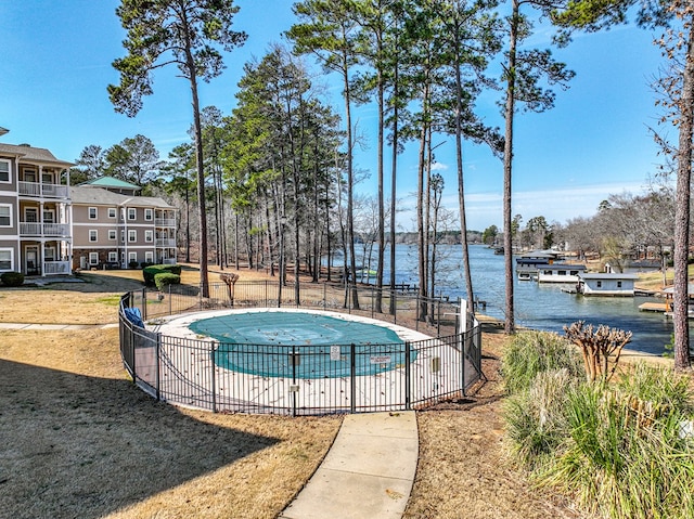 222 Sheffield Dr Unit E-5, Sparta, GA 31087 - community pool featuring a water view and fence
