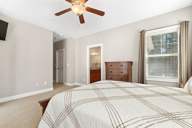 222 Sheffield Dr Unit E-5, Sparta, GA 31087 - carpeted bedroom with baseboards, a ceiling fan, and ensuite bath