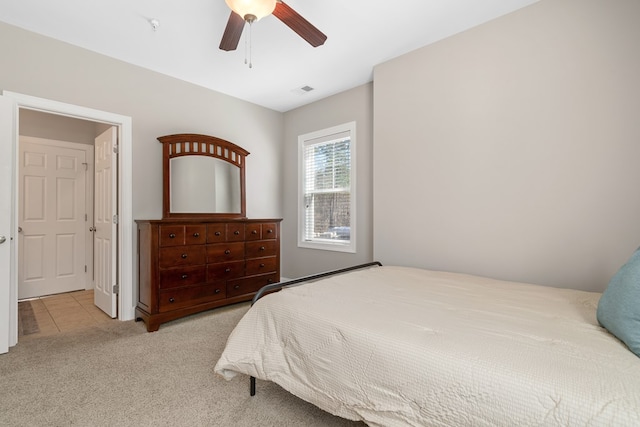 222 Sheffield Dr Unit E-5, Sparta, GA 31087 - bedroom with a ceiling fan, tile patterned flooring, and carpet floors