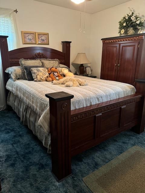 bedroom featuring dark colored carpet