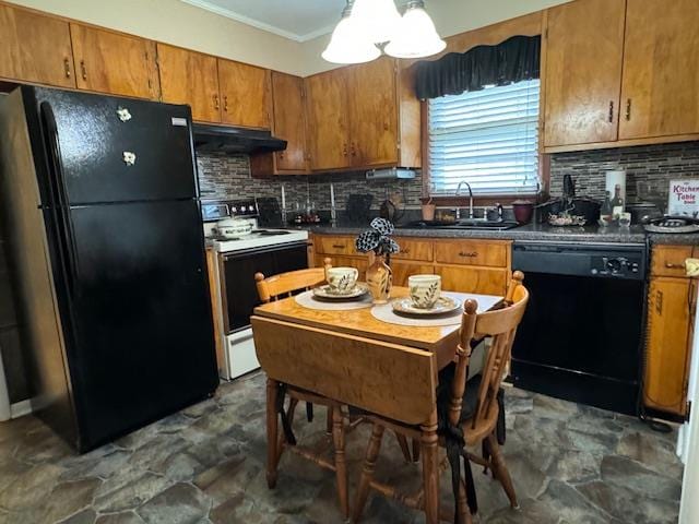 kitchen with sink, tasteful backsplash, a notable chandelier, and black appliances