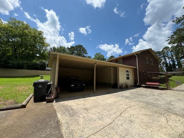 exterior space with a front lawn and a carport