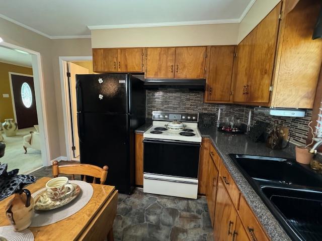 kitchen featuring black refrigerator, tasteful backsplash, ornamental molding, sink, and white range with electric cooktop