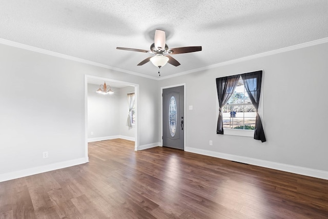 entrance foyer with ornamental molding, wood finished floors, and baseboards