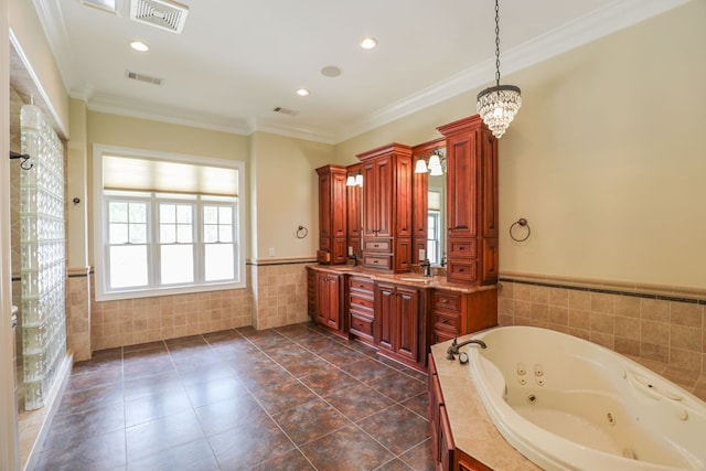 bathroom with vanity, an inviting chandelier, tile patterned floors, crown molding, and tiled bath