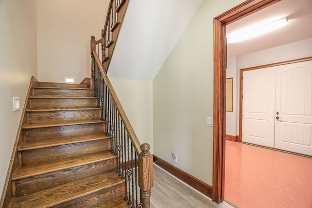 stairs with wood-type flooring