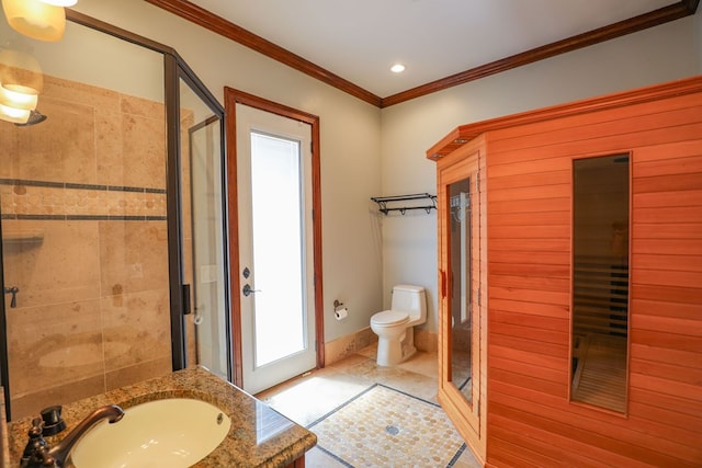 bathroom featuring crown molding, toilet, vanity, and walk in shower