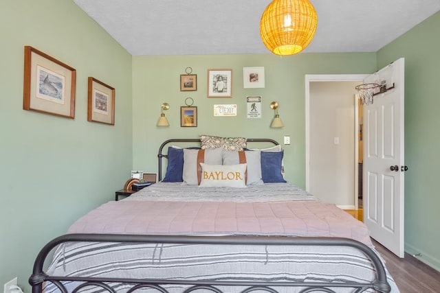 3657 Sussex Dr, Milledgeville, GA 31061 - bedroom with baseboards and wood finished floors