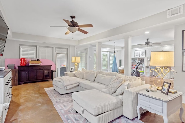 3657 Sussex Dr, Milledgeville, GA 31061 - living room with a ceiling fan, ornate columns, finished concrete floors, and visible vents