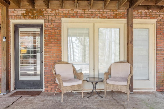 3657 Sussex Dr, Milledgeville, GA 31061 - interior space featuring carpet flooring, brick wall, and beamed ceiling