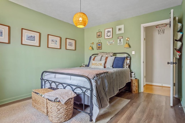 3657 Sussex Dr, Milledgeville, GA 31061 - bedroom with baseboards and wood finished floors