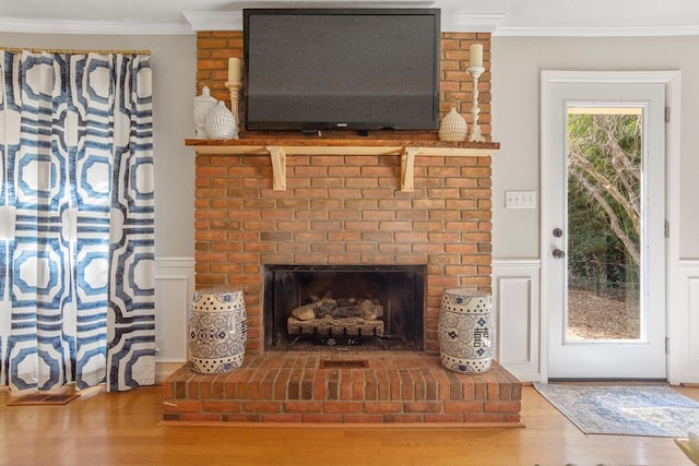 3657 Sussex Dr, Milledgeville, GA 31061 - room details featuring crown molding, a brick fireplace, and wood finished floors