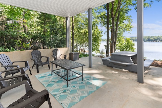 view of patio featuring a water view