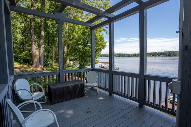 sunroom / solarium with a water view