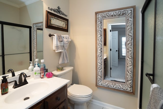 bathroom with crown molding, vanity, and toilet