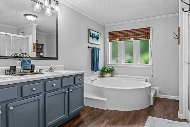126A N Little River Run, Eatonton, GA 31024 - full bath with a textured ceiling, wood finished floors, a stall shower, a garden tub, and double vanity