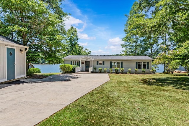 126A N Little River Run, Eatonton, GA 31024 - single story home with a front lawn, a water view, and concrete driveway