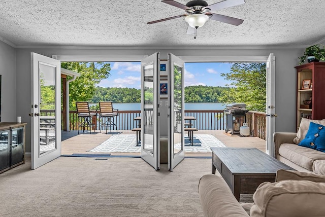 126A N Little River Run, Eatonton, GA 31024 - living room with healthy amount of natural light, a water view, ceiling fan, carpet flooring, and a textured ceiling