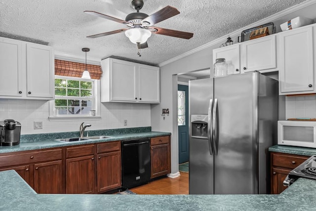 126A N Little River Run, Eatonton, GA 31024 - kitchen with stainless steel refrigerator with ice dispenser, a textured ceiling, white microwave, crown molding, and black dishwasher
