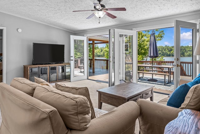 126A N Little River Run, Eatonton, GA 31024 - carpeted living area with a ceiling fan, crown molding, a textured ceiling, and french doors