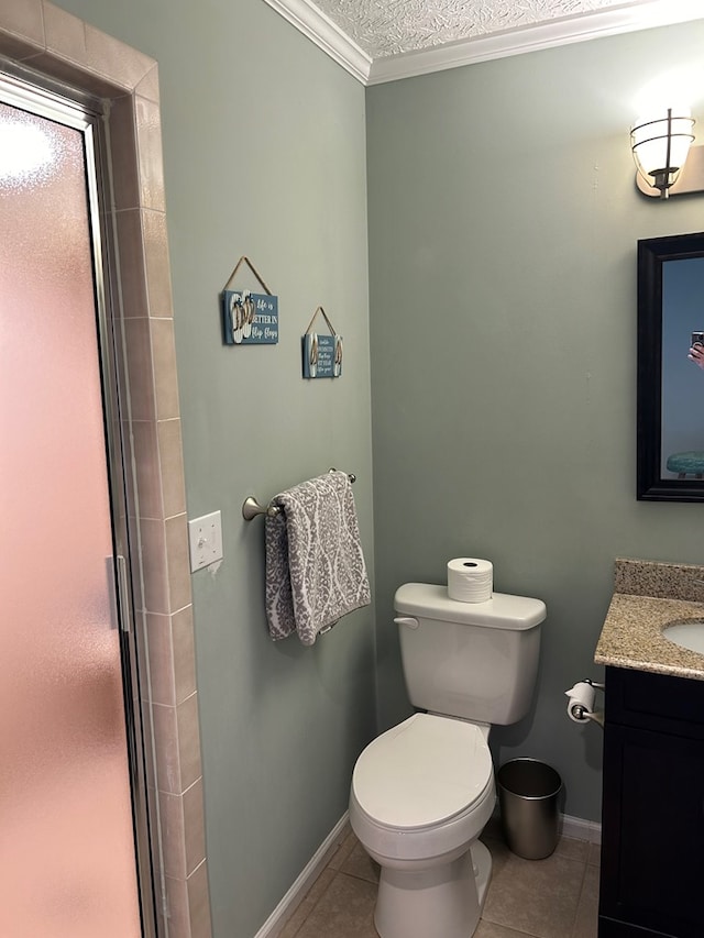 bathroom with tile patterned flooring, vanity, a textured ceiling, and ornamental molding