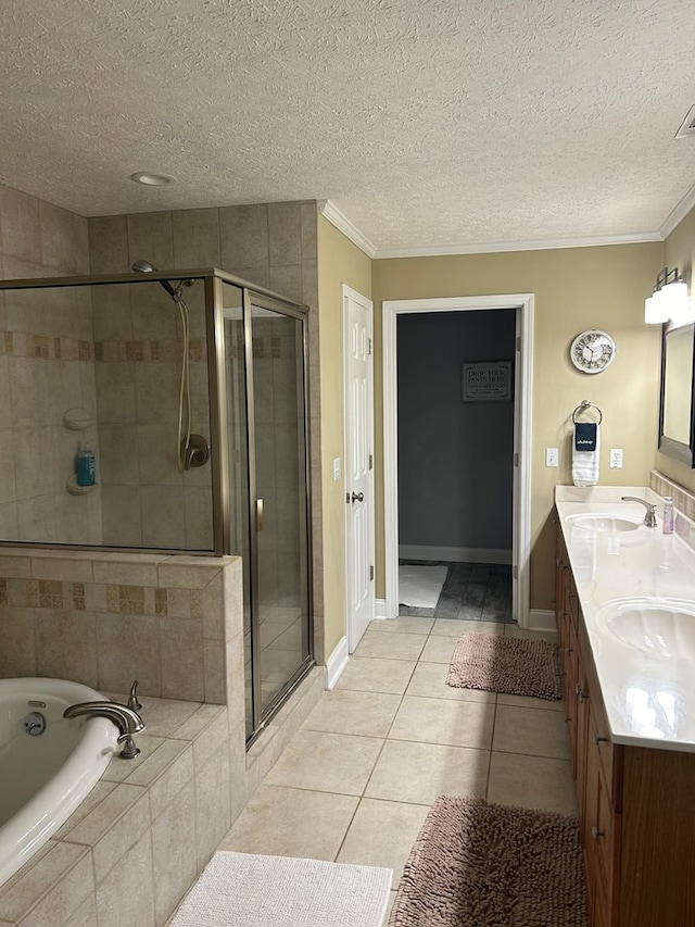 bathroom featuring tile patterned floors, vanity, separate shower and tub, and ornamental molding