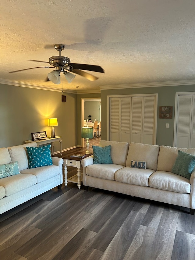 living room with ceiling fan, wood-type flooring, a textured ceiling, and ornamental molding