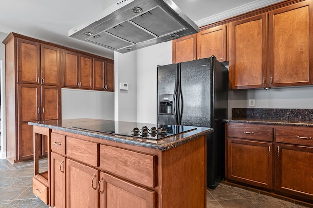 kitchen with ventilation hood, a kitchen island, dark stone counters, and black appliances