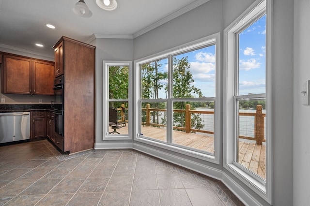 kitchen featuring stainless steel dishwasher, plenty of natural light, ornamental molding, and black double oven