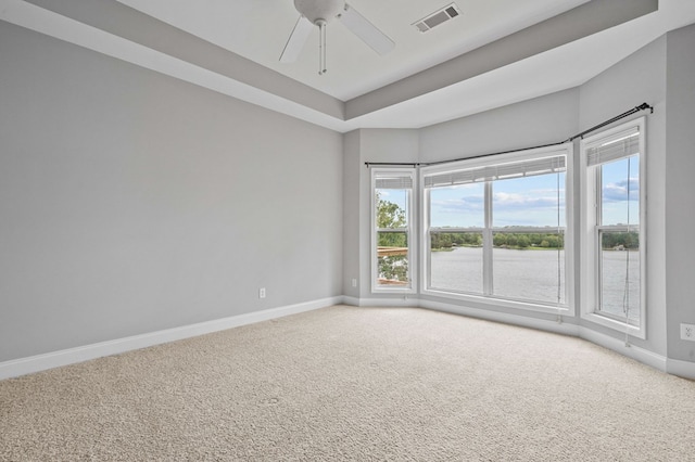 empty room featuring carpet flooring and ceiling fan