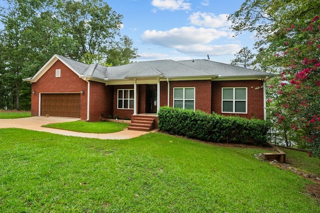 ranch-style house featuring a garage and a front yard