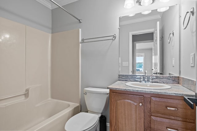 full bathroom with vanity, toilet, crown molding, and bathtub / shower combination