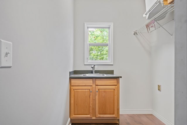 interior space featuring sink and light hardwood / wood-style floors