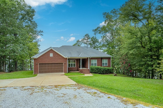 view of front of property featuring a front lawn and a garage