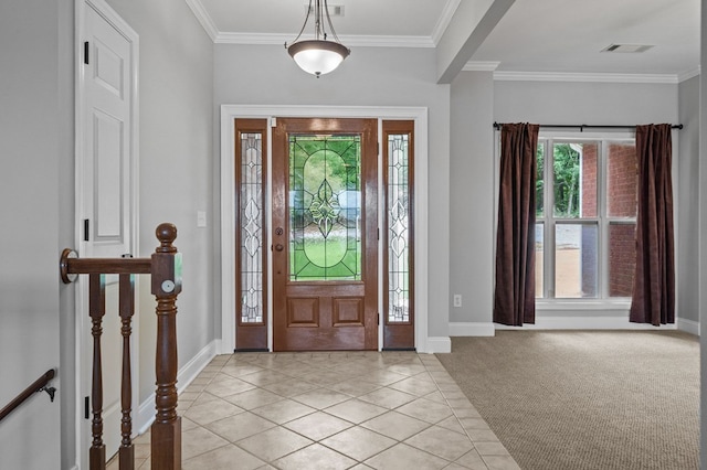 entryway with a wealth of natural light, light colored carpet, and ornamental molding